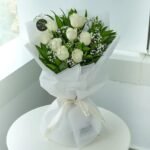 White wrapped with white rose bouquet online in Jaipur for Father's Day and special occasions