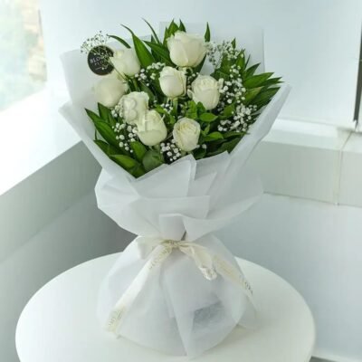 White wrapped with white rose bouquet online in Jaipur for Father's Day and special occasions